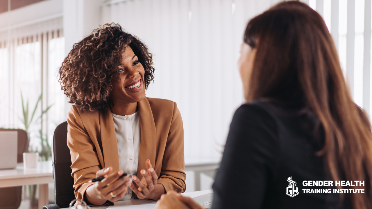 Clinical professional confidently consulting with a client because the professional just finished their gender affirming care training at the Gender Health Training Institute